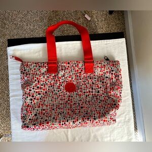 Kipling Large geometric tote withe orange accent missing charm.